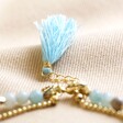 close up of tassel and extender chain on personalised Semi-Precious Stone Bead and Chain Anklet in Pastel Blue