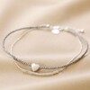 Silver and Grey Beaded Anklet on Beige Fabric