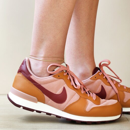 Model Wearing Stainless Steel Double Snake Chain Anklet in Gold