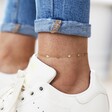 Model Wearing Stainless Steel Starry Anklet in Gold