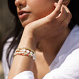 Model Wearing Love Semi Precious Stone Beaded Bracelet in Gold with Other Beads