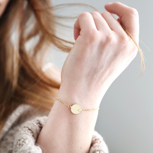 Model Wearing Disc and Figaro Chain Bracelet in Gold