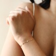 Close Up of Stainless Steel Starry Bracelet in Gold on Model