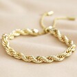 Plaited Rope Chain Bracelet in Gold on Beige Fabric