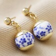 Blue Willow Stud Drop Earrings in Gold on Fabric