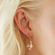 Model Wearing Colourful Bead and Pearl Hoop Earrings in Gold