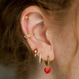 Red Enamel Heart Charm Huggie Hoop Earrings in Curated Ear