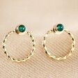 Emerald and Twisted Hoop Jacket Earrings in Gold on Fabric