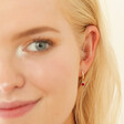 Model Wearing July Ruby Gold Birthstone Huggie Hoop Earrings