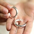 Model Holding Silver Chunky Polished Hoops