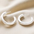 Polished Silver Chunky Hoops on Fabric