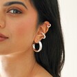 Chunky Silver Hoops layered on Model