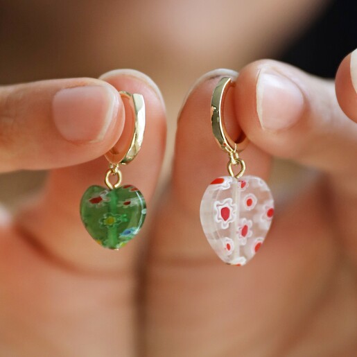 Model Holding Millefiori Colourful Heart Bead Huggie Hoop Earrings