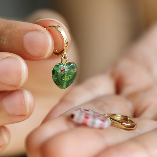 Model Holding Millefiori Colourful Heart Bead Huggie Hoop Earrings in Hands