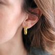 Close Up of Model Wearing Mustard Floral Enamel Hoop Earrings in Gold