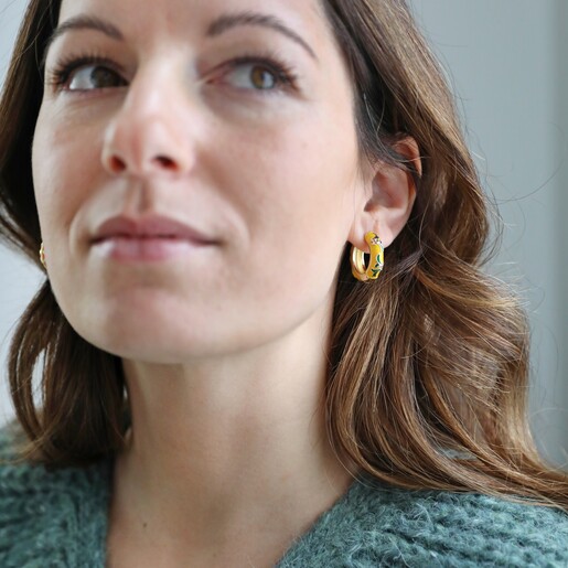 Model Wearing Mustard Floral Enamel Hoop Earrings in Gold