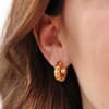 Close Up of Model Wearing Orange Geometric Enamel Hoop Earrings in Gold