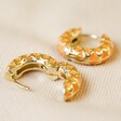 Open and Closed Orange Geometric Enamel Hoop Earrings in Gold on Fabric