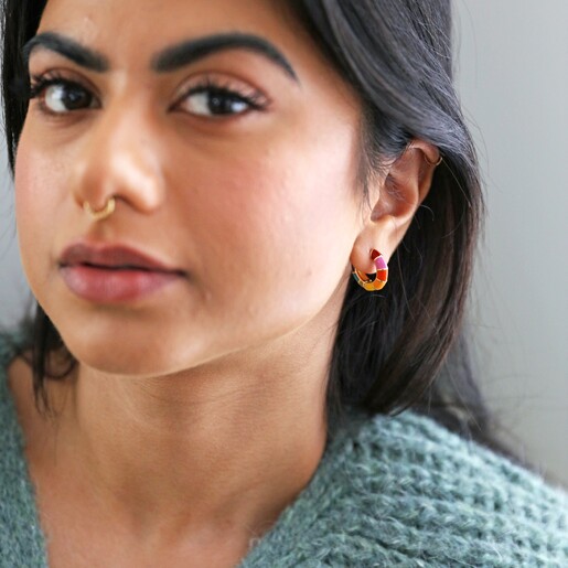 model wearing Rainbow Geometric Enamel Hoop Earrings in Gold