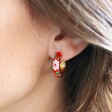 Model Wearing Red Floral Enamel Hoop Earrings in Gold