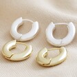 Small Chunky Huggie Hoop Earrings in Gold and Silver on Beige Fabric
