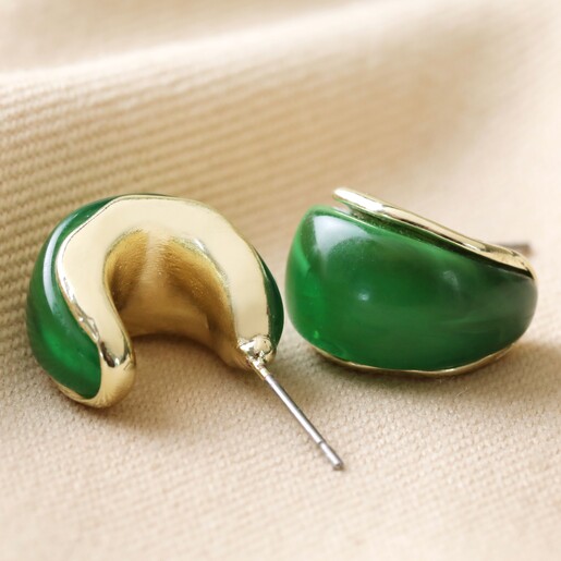 Small Green Resin Hoop Earrings in Gold Two Small Green Resin Hoop Earrings in Gold on Fabric