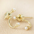 Tiny Pearl Jacket Earrings in Gold on fabric