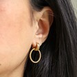 Model Wearing Gold Twisted Drop Hoop Earrings