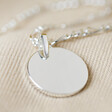 Disc and Figaro Chain Necklace in Silver on fabric background