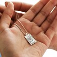 Model Holding Enamel The Fortune Tarot Card Necklace in Silver