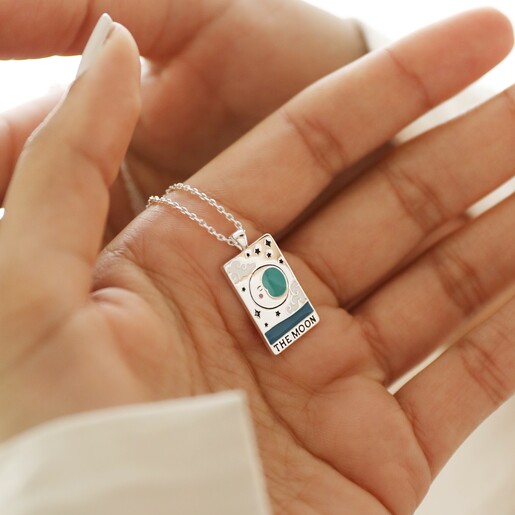 Model Holding Enamel The Moon Tarot Card Necklace in Silver