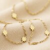 Long Starry Necklace in Gold Close-up