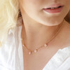 Model Wearing Beaded Daisy Satellite Chain Necklace in Gold