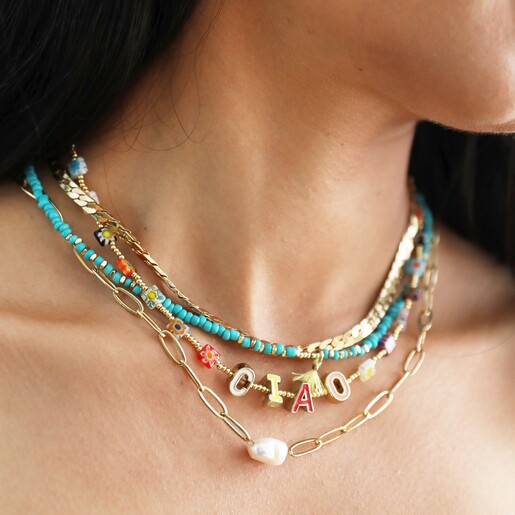 Close Up of Model Wearing Necklaces Layered with Millefiori Bead Ciao Necklace