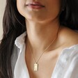 Brunette Model Wearing Personalised Enamel Tarot Card Necklace in Gold