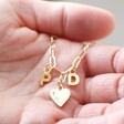 Model Holding Personalised Initials and Heart Charm Rectangle Chain Necklace