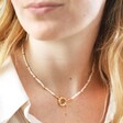 model wearing Round Clasp and Pearls Necklace in Gold