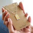 Model Holding The Sun Personalised Enamel Tarot Card Necklace in Silver