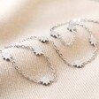 Stainless Steel Long Starry Necklace in Silver on Beige Fabric