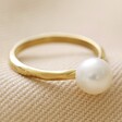 Pearl Ring in Hammered Gold on Fabric