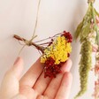 Model Holding Dried Flower Posy Bunting