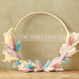 some bunny loves you Easter Dried Flower Bamboo Hoop Wreath lent against green wall