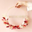 Model Holding Must Be Love Valentine's Dried Flower Bamboo Hoop Wreath