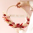 Must Be Love Valentine's Dried Flower Bamboo Hoop Wreath Held by Model