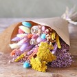 Pastel Easter Dried Flower Bouquet laying on wooden table