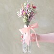 Model Holding Pink and Yellow Dried Flower Posy with Vase