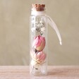 Small Dried Flower Glass Bottle on Wooden Table