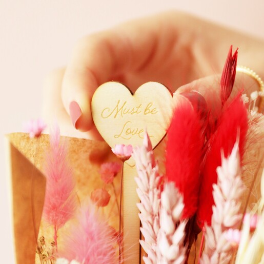 Close Up of Wooden 'Must Be Love' Stick from Valentine's Dried Flower Posy with Engraved Stick