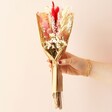 Model Holding 'Must Be Love' Valentine's Dried Flower Posy with Engraved Stick