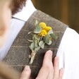 Model Wearing Eucalyptus & Yellow Dried Flower Buttonhole